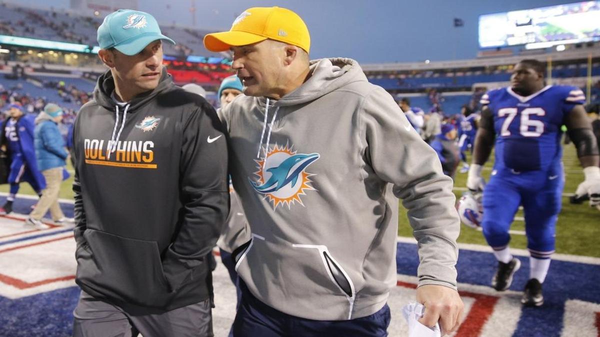 Bills linbacker Jerry Hughes could hear from the league after appearing to ram Dolphins special teams coordinator Darren Rizzi, right, with his helmet after a kick return.