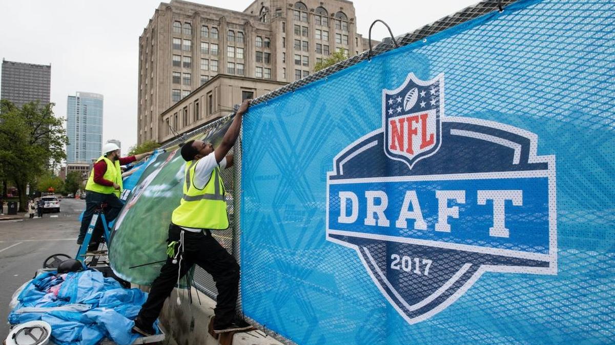 Workers make preparations ahead of the 2017 NFL football draft, in Philadelphia, Wed., April 26, 2017.