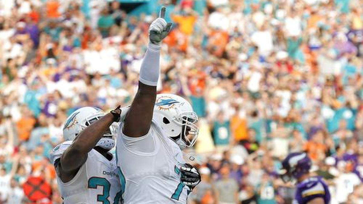
Miami Dolphins defensive end Terrence Fede (78) celebrates after blocking a punt by Minnesota Vikings punter Jeff Locke (18) for a safety in the fourth quarter as the Miami Dolphins play host to the Minnesota Vikings at Sun Life Stadium on Sunday, Dec. 21, 2014.
