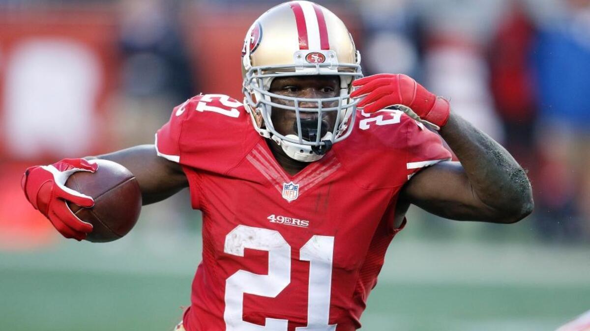 San Francisco 49ers running back Frank Gore (21) runs against the Arizona Cardinals during the fourth quarter of an NFL football game in Santa Clara, Calif., Sunday, Dec. 28, 2014.