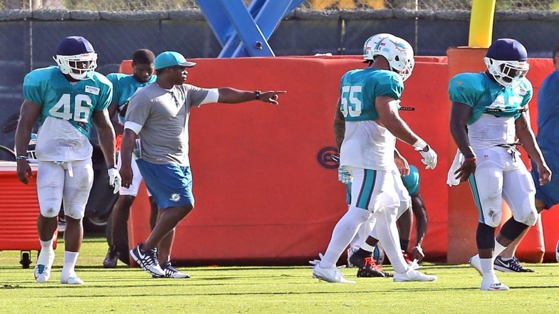 Defensive coordinator Vance Joseph works with the defense at the Miami Dolphins training facility in Davie, Florida, Aug. 5, 2016.