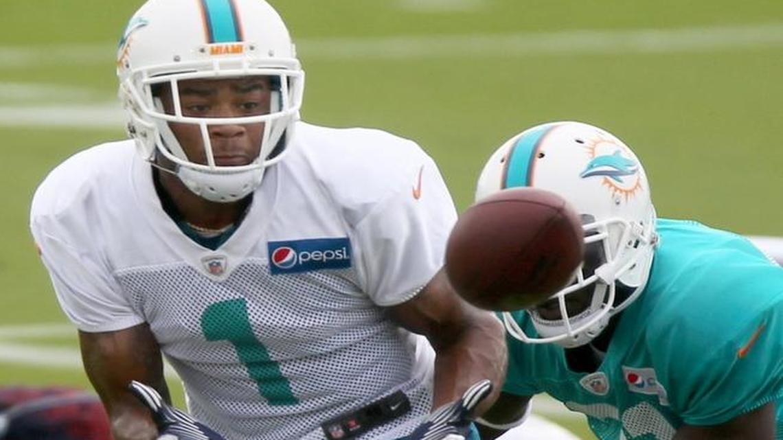 Christion Jones catches a pass during Dolphins training camp last summer.