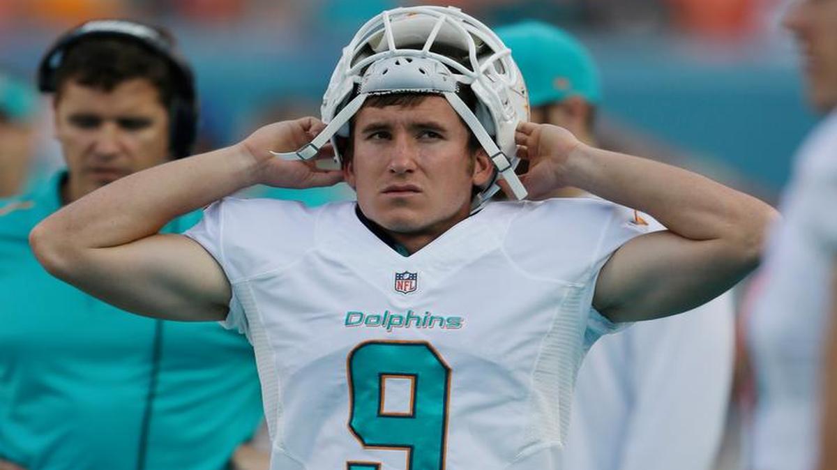
Miami Dolphins kicker Caleb Sturgis (9) walks along the sideline during the second half of an NFL football game against the Baltimore Ravens, Sunday, Dec. 7, 2014 in Miami Gardens, Fla. 
