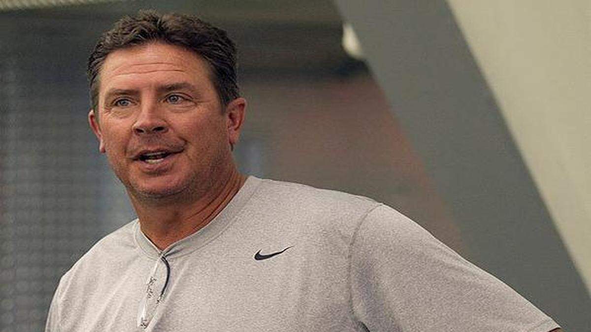 
Former Miami Dolphins quarterback Dan Marino watches practice during minicamp in Davie on June 12, 2013.
