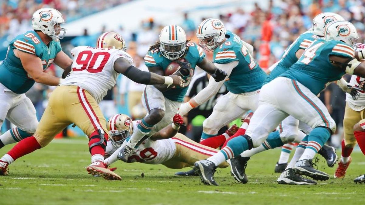 Miami Dolphins running back Jay Ajayi (23) breaks away for yardage in the second half as the Miami Dolphins host the San Francisco 49ers at Hard Rock Stadium in Miami Gardens on Nov. 27, 2016