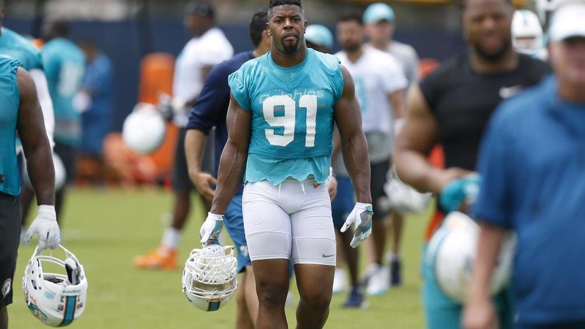 Miami Dolphins defensive end Cameron Wake (91) walks after the NFL football minicamp, Thurs., June 15, 2017, at the team's training facility in Davie.
