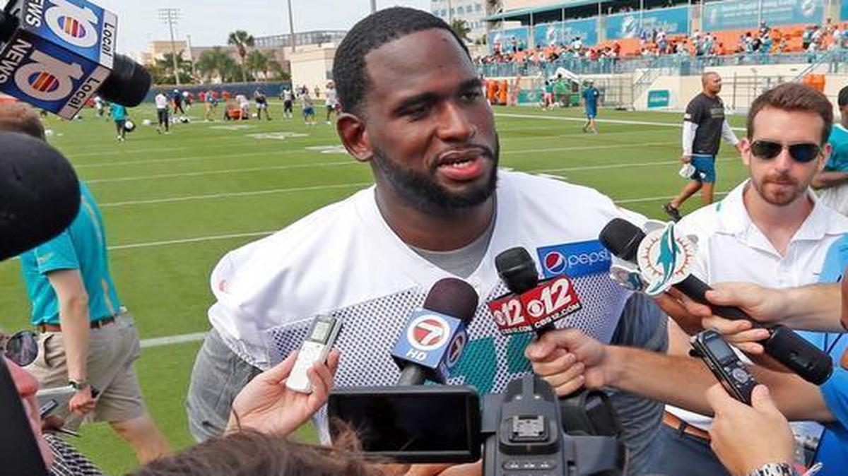 
Left tackle Branden Albert talks to the media on the first day of Miami Dolphins training camp Thursday, July 30, 2015 in Davie.
