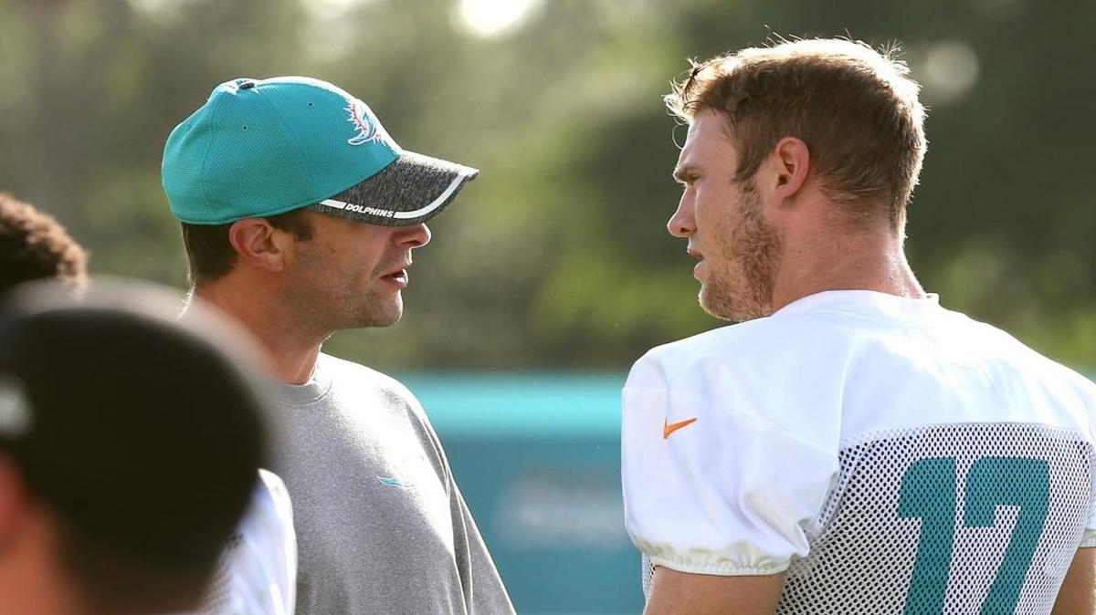Dolphins coach Adam Gase, left, and quarterback Ryan Tannehill will try to beat Seattle’s Russell Wilson on Sunday.