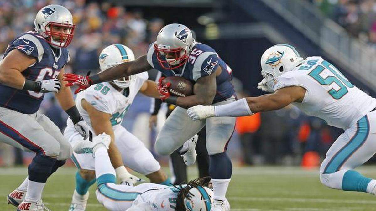 
New England Patriots running back Jonas Gray (35) breaks a tackle by Miami Dolphins linebacker Kelvin Sheppard (97) in the fourth quarter as the New England Patriots host the Miami Dolphins at Gillette Stadium on Sunday, Dec. 14, 2014
