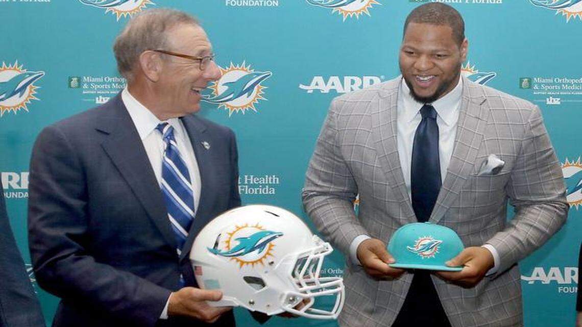 
Miami Dolphins owner Stephen M. Ross, left, with Ndamukong Suh at a news conference on Wednesday, March 11, 2015, in Davie, Fla. 
