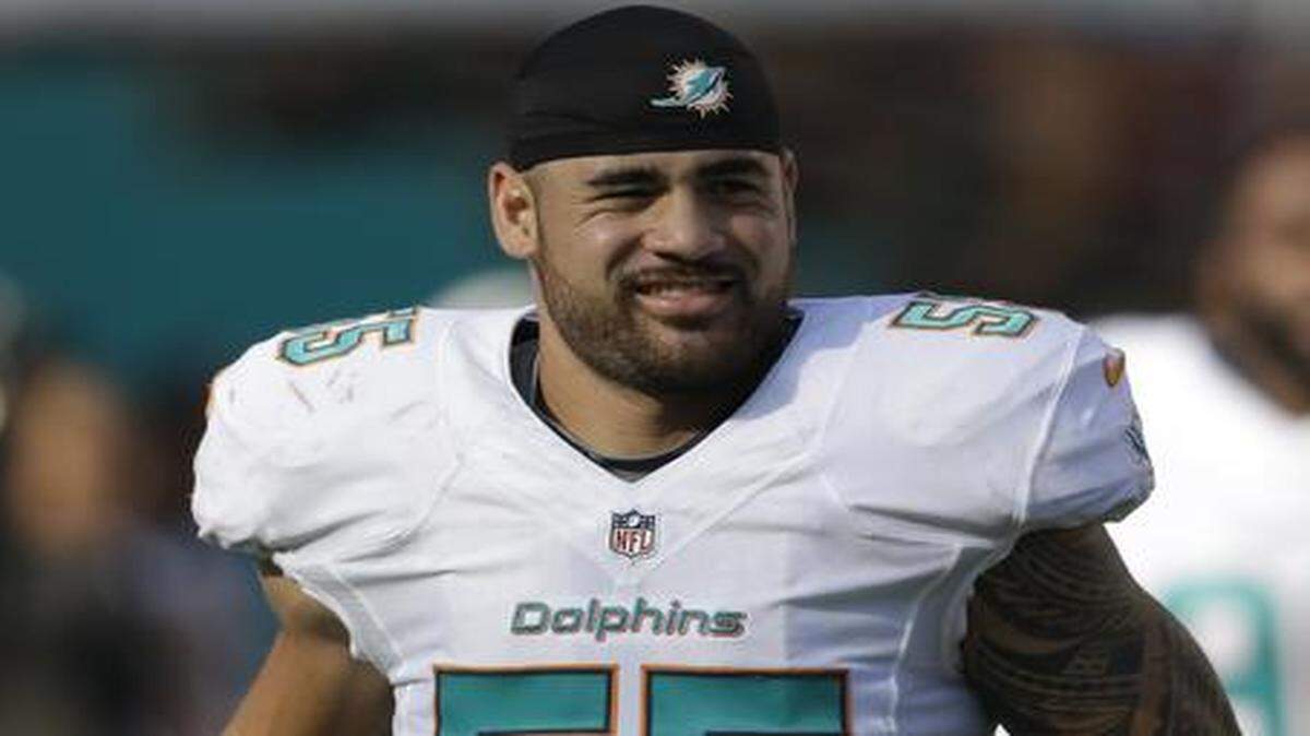 
Miami Dolphins linebacker Koa Misi walks the sideline during the second half against the Baltimore Ravens, Sunday, Dec. 7, 2014, in Miami Gardens, Fla. 
