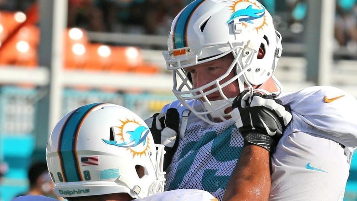 Sam Young, right, will be back in Miami for at least one more season.