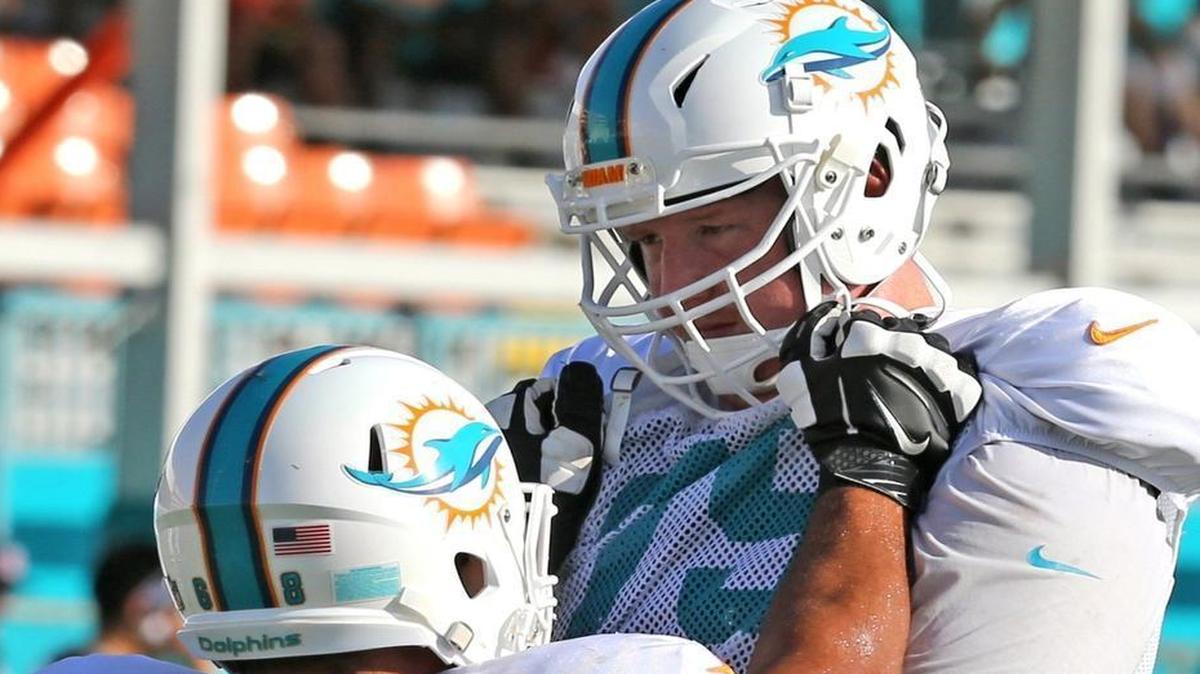 Sam Young, right, will be back in Miami for at least one more season.