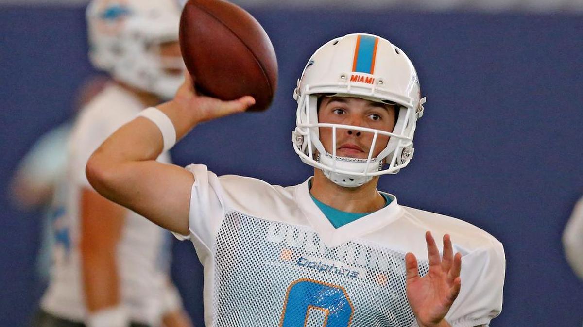 Miami Dolphins quarterback David Fales throws in a June practice. Fales is competing for the backup QB job.