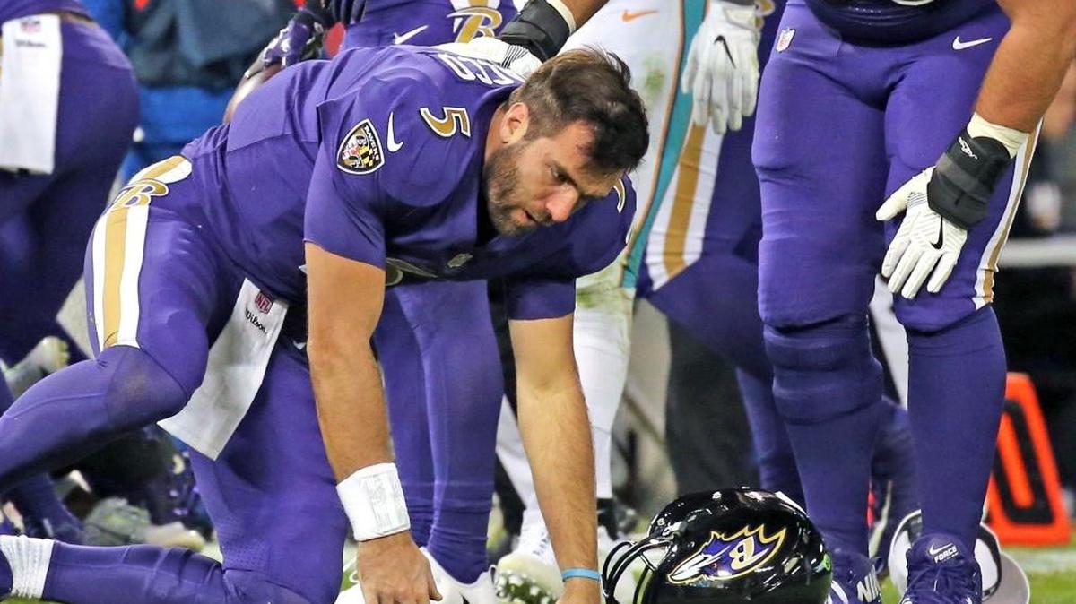 Baltimore Ravens quarterback Joe Flacco (6) gets up slowly after being hit by Miami Dolphins Kiko Alonso in the second quarter at the M&T Bank Stadium in Baltimore, Maryland, Oct. 26, 2017.