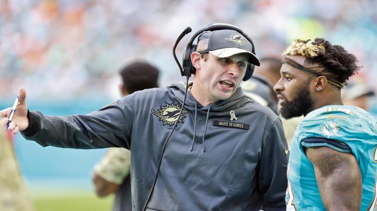 Miami Dolphins head coach Adam Gase talks with wide receiver Jarvis Landry (14) as the Miami Dolphins host the New York Jets at Hard Rock Stadium on Sun., Nov. 6, 2016.
