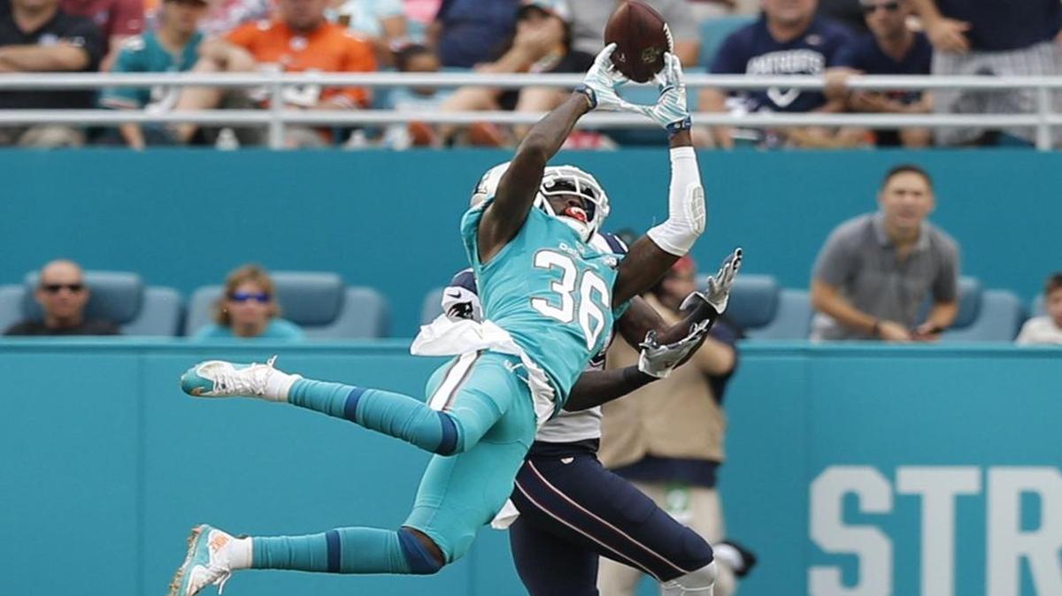 Miami Dolphins defensive back Tony Lippett (36) blocks a pass intended for New England Patriots wide receiver Brandon LaFell (19) in the third quarter as the Miami Dolphins host the New England Patriots at Sun Life Stadium on Sun., Jan.3, 2016