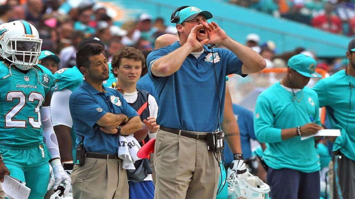 Miami Dolphins interim coach Dan Campbell watches on the sidelines in the fourth quarter as they play the New England Patriots at Sun Life Stadium in Miami Gardens on January 3, 2016.