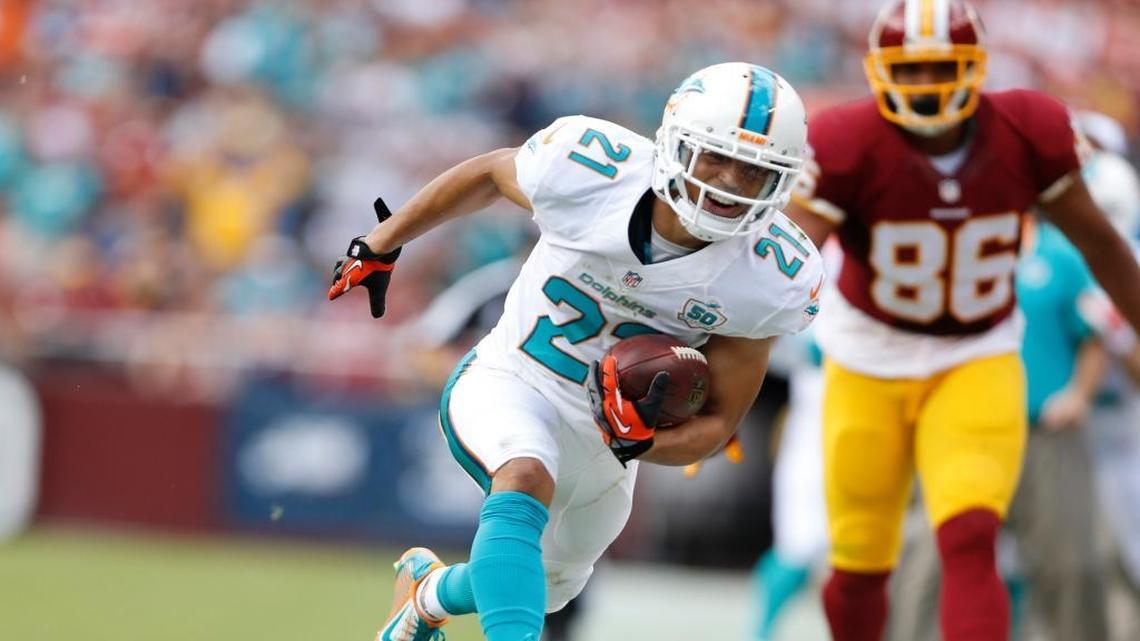 File photo: Miami Dolphins cornerback Brent Grimes (21) intercepts in the second quarter. The Washington Redskins host the Miami Dolphins at FedExField in Landover, Maryland on Sunday, September 13, 2015.