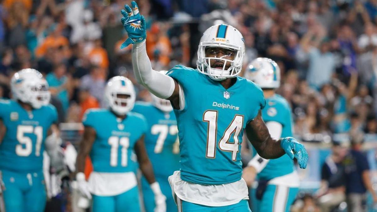 In this Sun., Nov. 5, 2017, file photo, Miami Dolphins wide receiver Jarvis Landry waves to fans after scoring a touchdown.