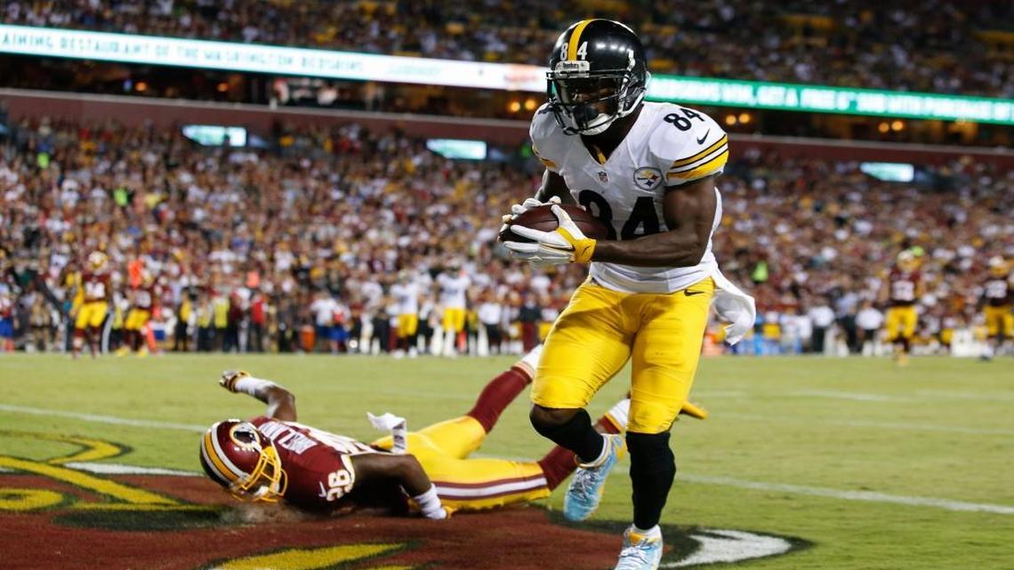 Washington Redskins cornerback Bashaud Breeland (26) lands on the turf as Pittsburgh Steelers wide receiver Antonio Brown (84) scores a touchdown during the second half of an NFL football game in Landover, Md., Mon., Sept. 12, 2016.