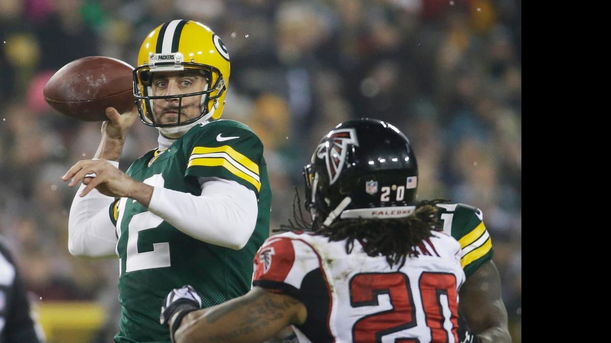 
Green Bay Packers' Aaron Rodgers throws during the first half against the Atlanta Falcons Monday, Dec. 8, 2014, in Green Bay, Wis. 

