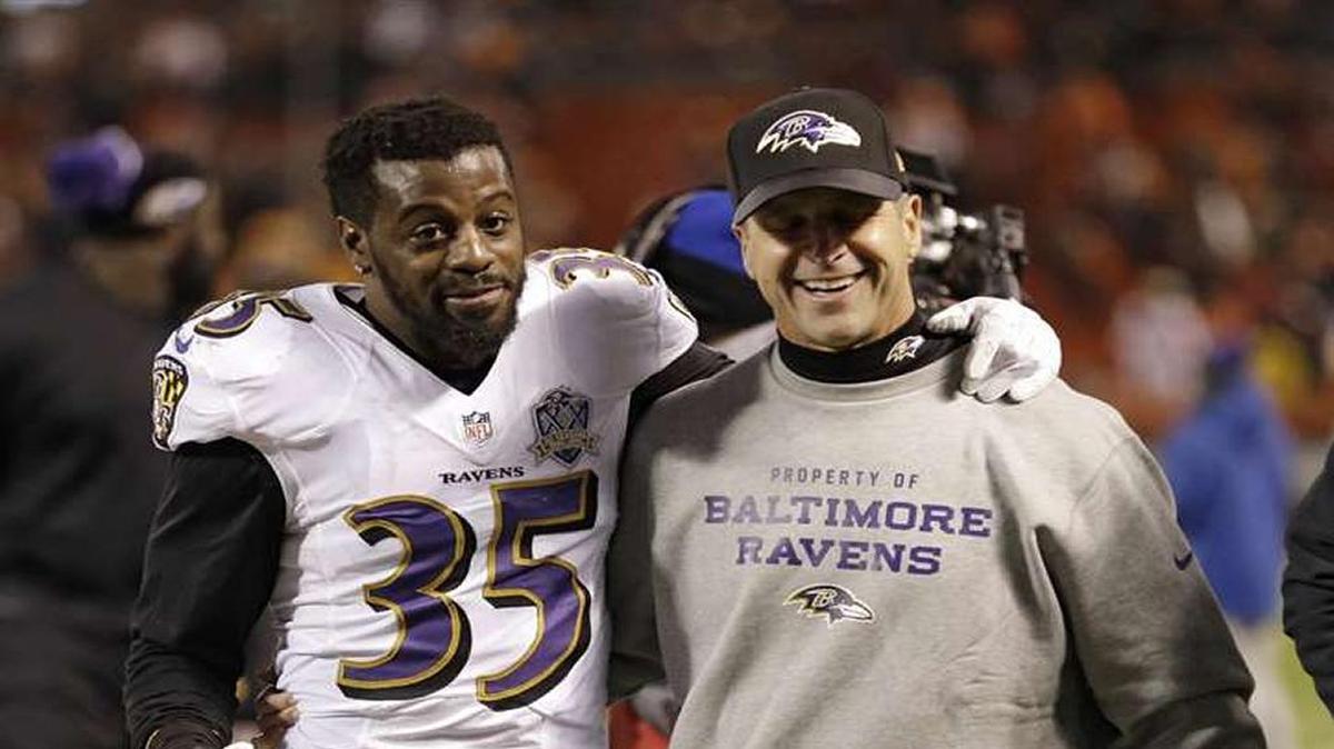 Shareece Wright (left), shown walking off field with Baltimore Ravens coach John Harbaugh in 2015, recently signed with the Buffalo Bills and took an Uber 540 miles from Chicago to Buffalo to get to camp on time.
