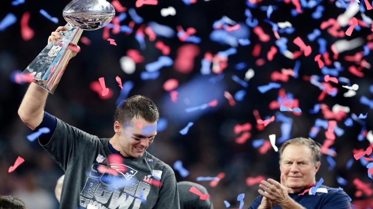 Tom Brady reacts with the Vince Lombardi Trophy after winning the NFL Super Bowl 51 football game against the Atlanta Falcons Sunday, Feb. 5, 2017, in Houston. Right is Patriots head coach Bill Belichick, who along with Brady won a record five Super Bowls. The Patriots won 34-28.