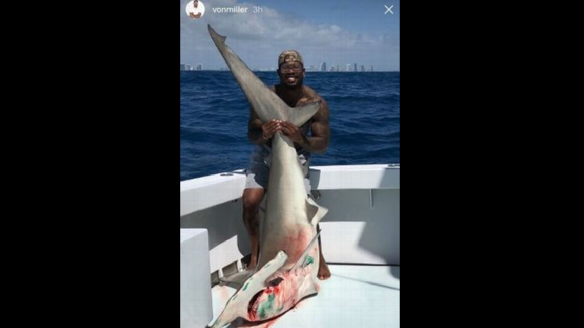 Von Miller posing with the 9-and-a-half foot hammerhead shark he caught off the coast of Miami