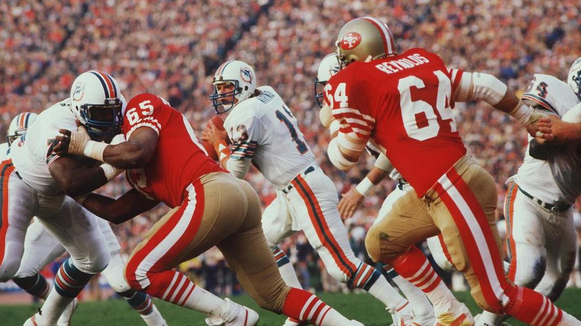 Miami quarterback Dan Marino rolls out, looking to the throw against the 49ers in Super Bowl 19.