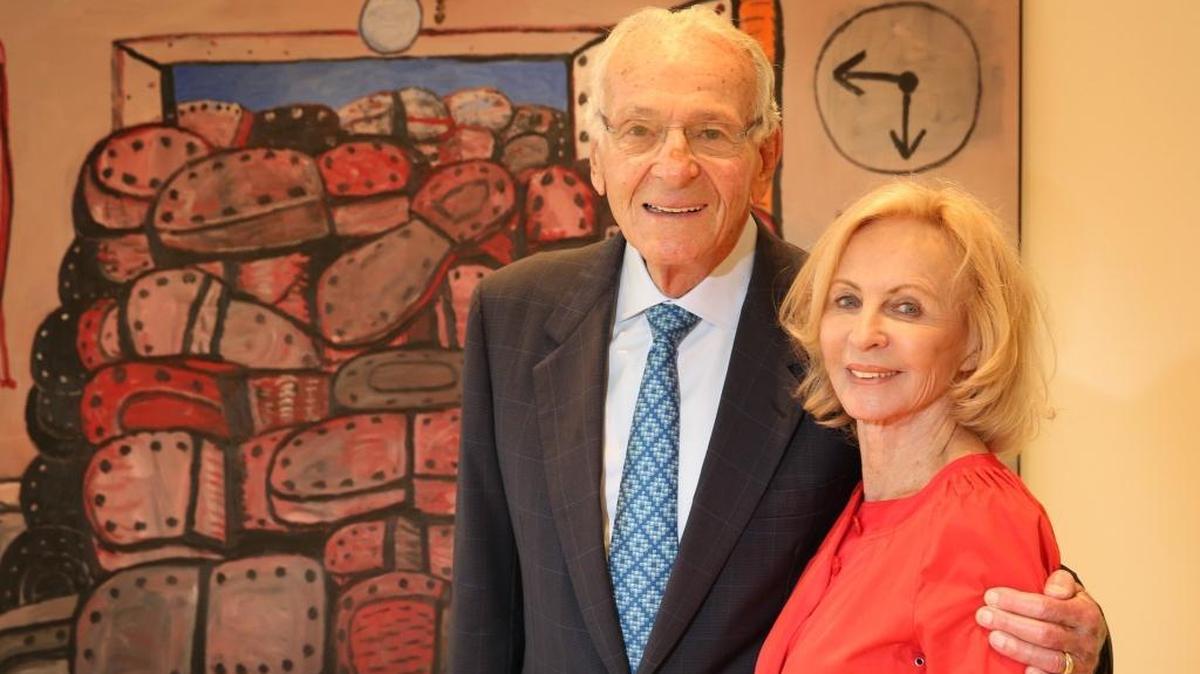 Pictured in a file photo, Norman and Irma Braman stand in a third floor exhibit at the brand new Institute for Contemporary Art in front of Philip Guston's The Door, 1976. Collection of Martin Z. Margulies.