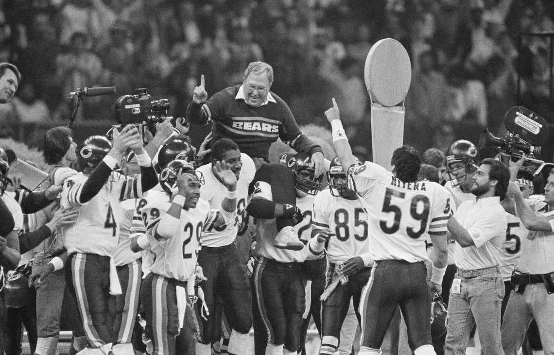 Chicago’s defense carries defensive coordinator Buddy Ryan off the field after the 46-10 destruction of New England in Super Bowl XX.