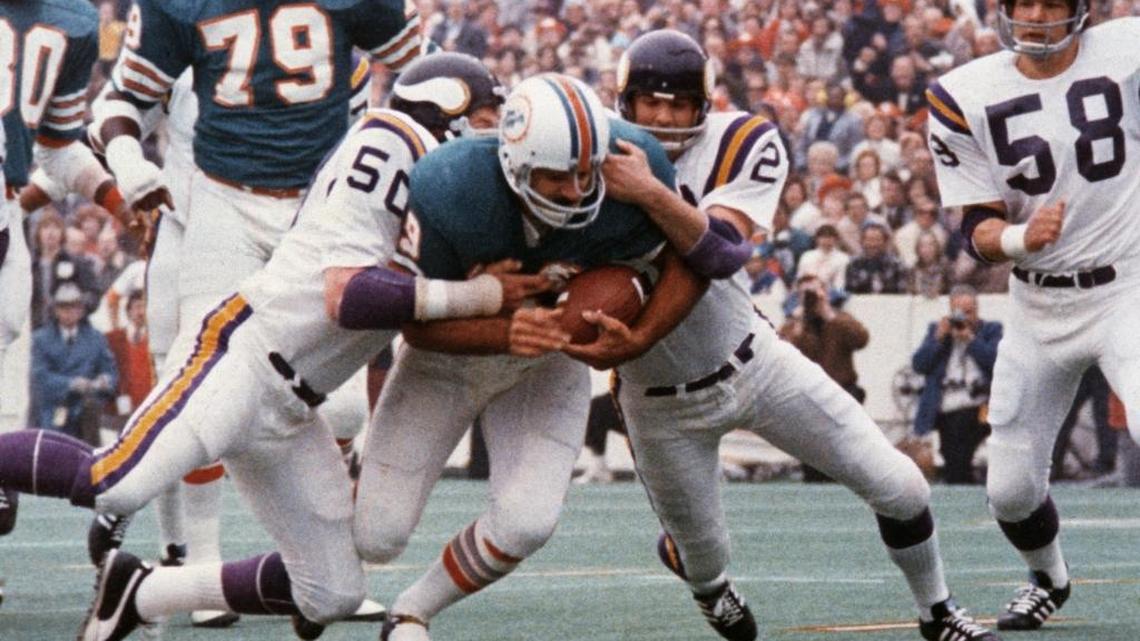 Miami’s Larry Csonka drives between Jeff Siemon (50) and Paul Krause for one of his two touchdowns in Super Bowl VIII. Miami defeated the Vikings 24-7, becoming the first team since the Green Bay Packers to win consecutive Super Bowls.