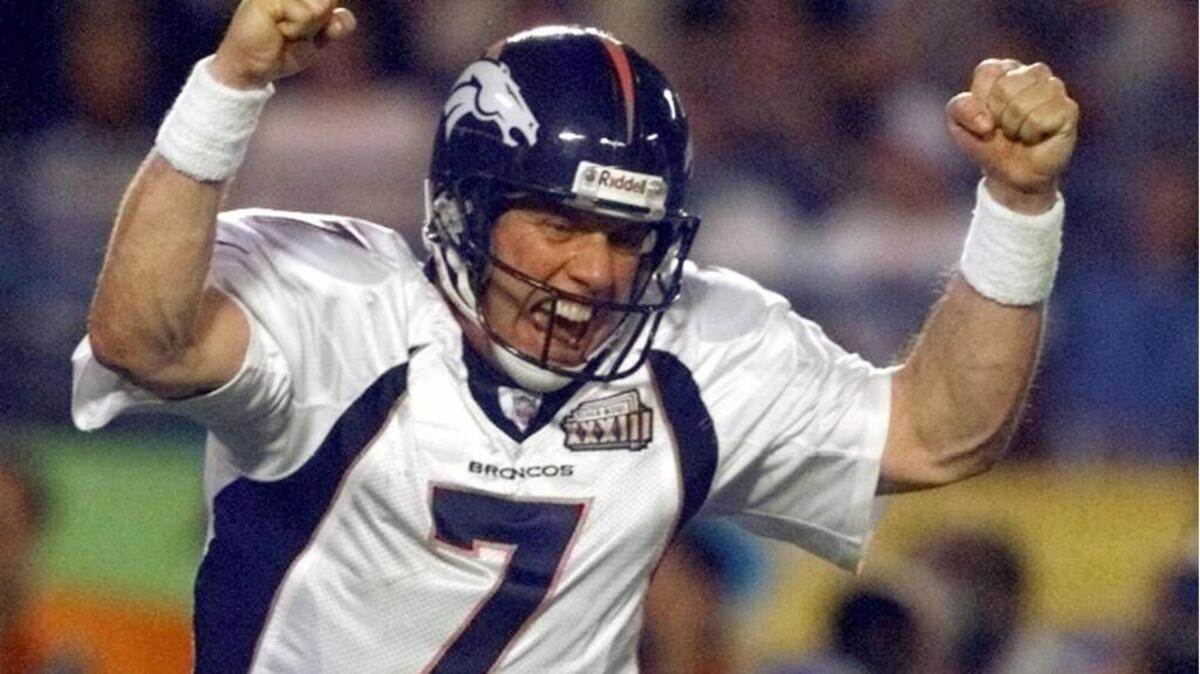 John Elway celebates a fourth quarter touchdown against the Atlanta Falcons during Super Bowl 33 in Miami as he was named MVP.