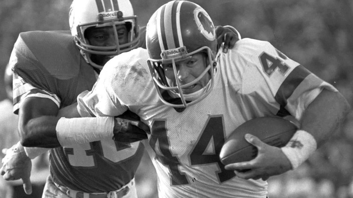 Washington Redskins running back John Riggins breaks away from Miami Dolphins cornerback Don McNeal on his way to the game-winning touchdown for the Redskins in the fourth quarter of Super Bowl XVII, in Pasadena, Calif., Jan. 30, 1983.