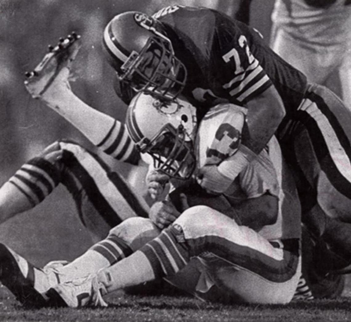 Dolphins QB Dan Marino is doubled over as he’s sacked by San Francisco's Jeff Stover, one of four sacks Marino took in the Dolphins 38-16 Super Bowl XIX loss to the 49ers Stanford Stadium.