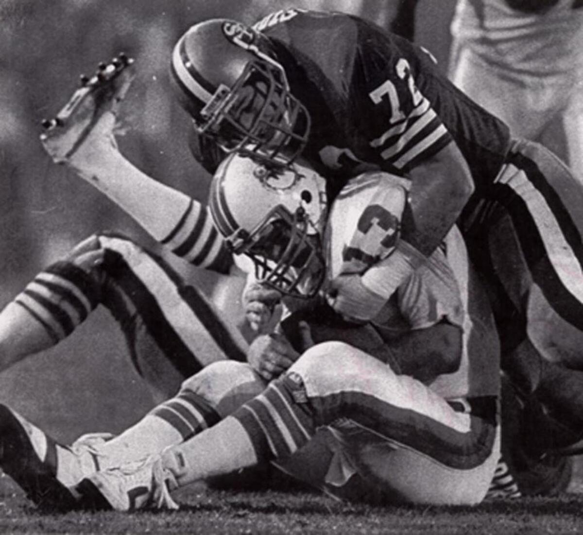 Dolphins QB Dan Marino is doubled over as he’s sacked by San Francisco's Jeff Stover, one of four sacks Marino took in the Dolphins 38-16 Super Bowl XIX loss to the 49ers Stanford Stadium.