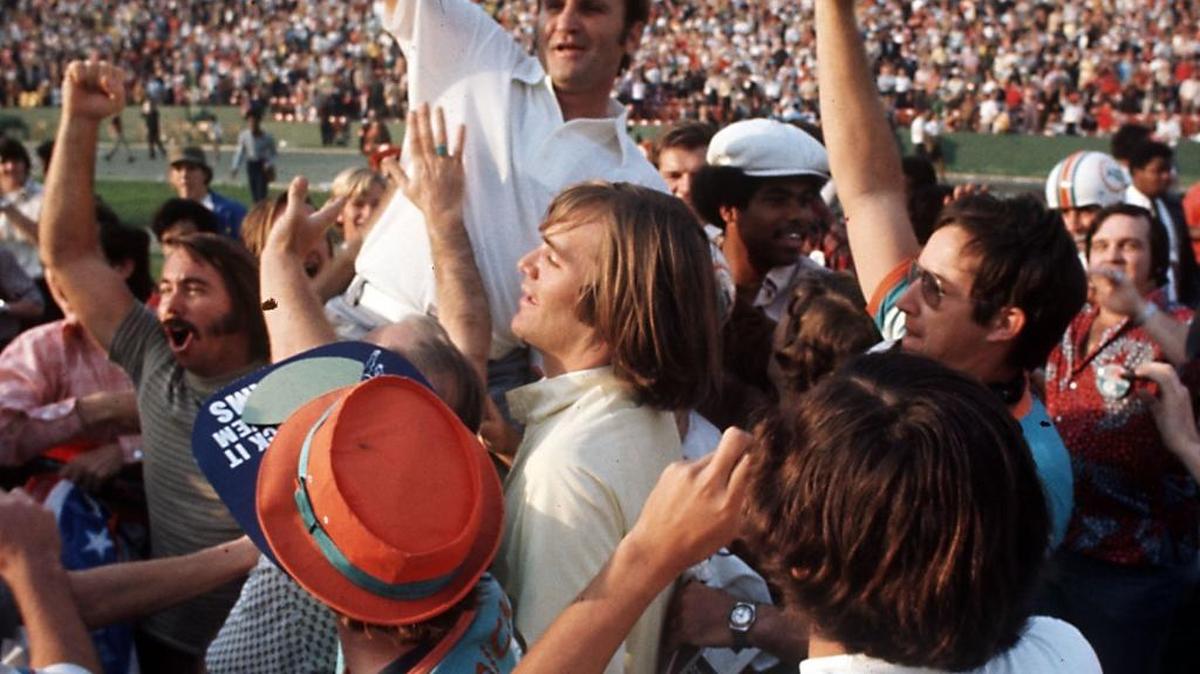 A smiling Miami Dolphins coach Don Shula is carried off the field after his team won the Super Bowl game with a 14-7 victory over the Washington Redskins during Super Bowl VII in Los Angeles.