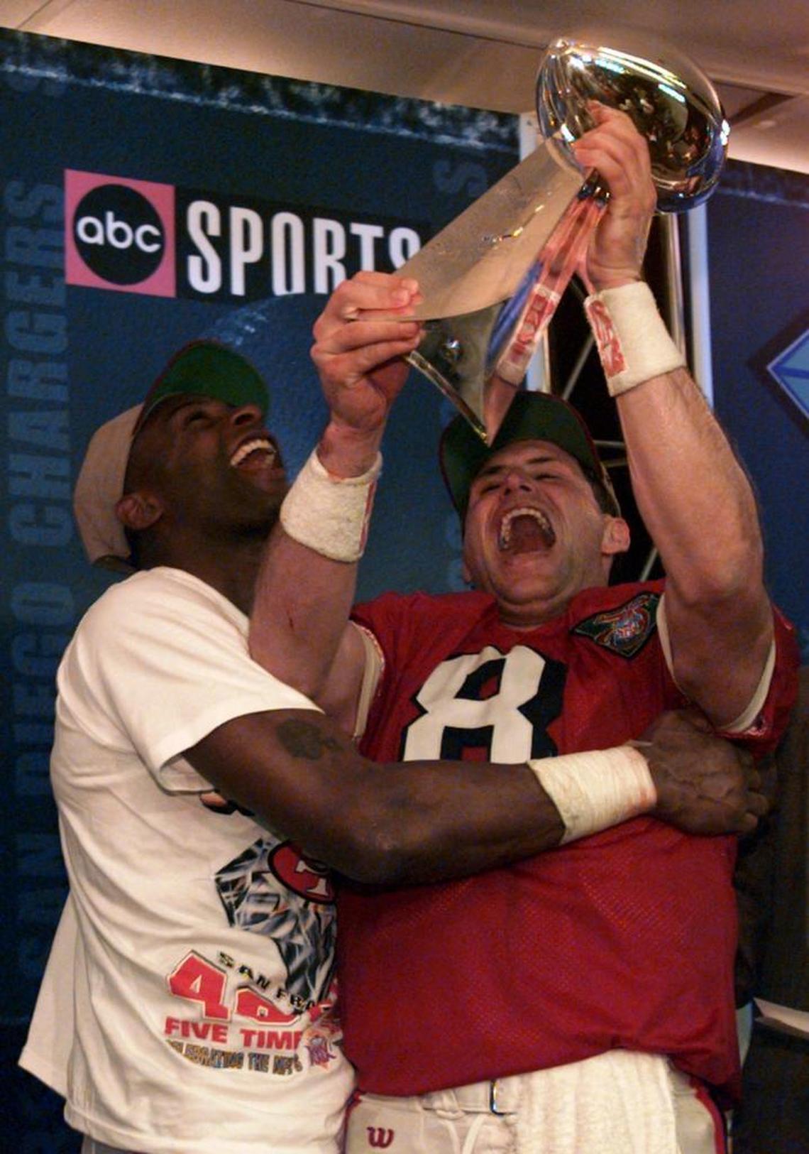 San Francisco wide receiver Jerry Rice, left, and quarterback Steve Young celebrate with the Vince Lombardi Trophy after the 49ers waxed the San Diego Chargers, 49-26, in Super Bowl XXIX in Joe Robbie Stadium.