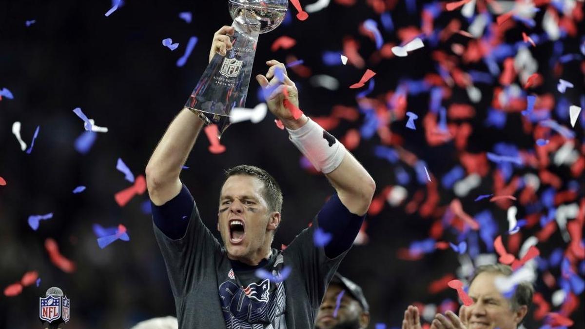 New England Patriots’ Tom Brady raises the Vince Lombardi Trophy after the Patriots’ Super Bowl LI overtime win against the Atlanta Falcons after trailing 28-3 in the third quarter.