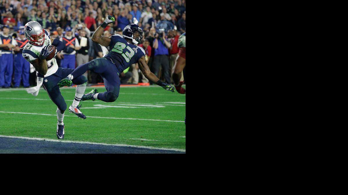 
New England Patriots strong safety Malcolm Butler (21) intercepts a pass intended for Seattle Seahawks wide receiver Ricardo Lockette (83) during the second half of Super Bowl XLIX at University of Phoenix Stadium in Glendale, Ariz. on Feb. 1, 2015.
