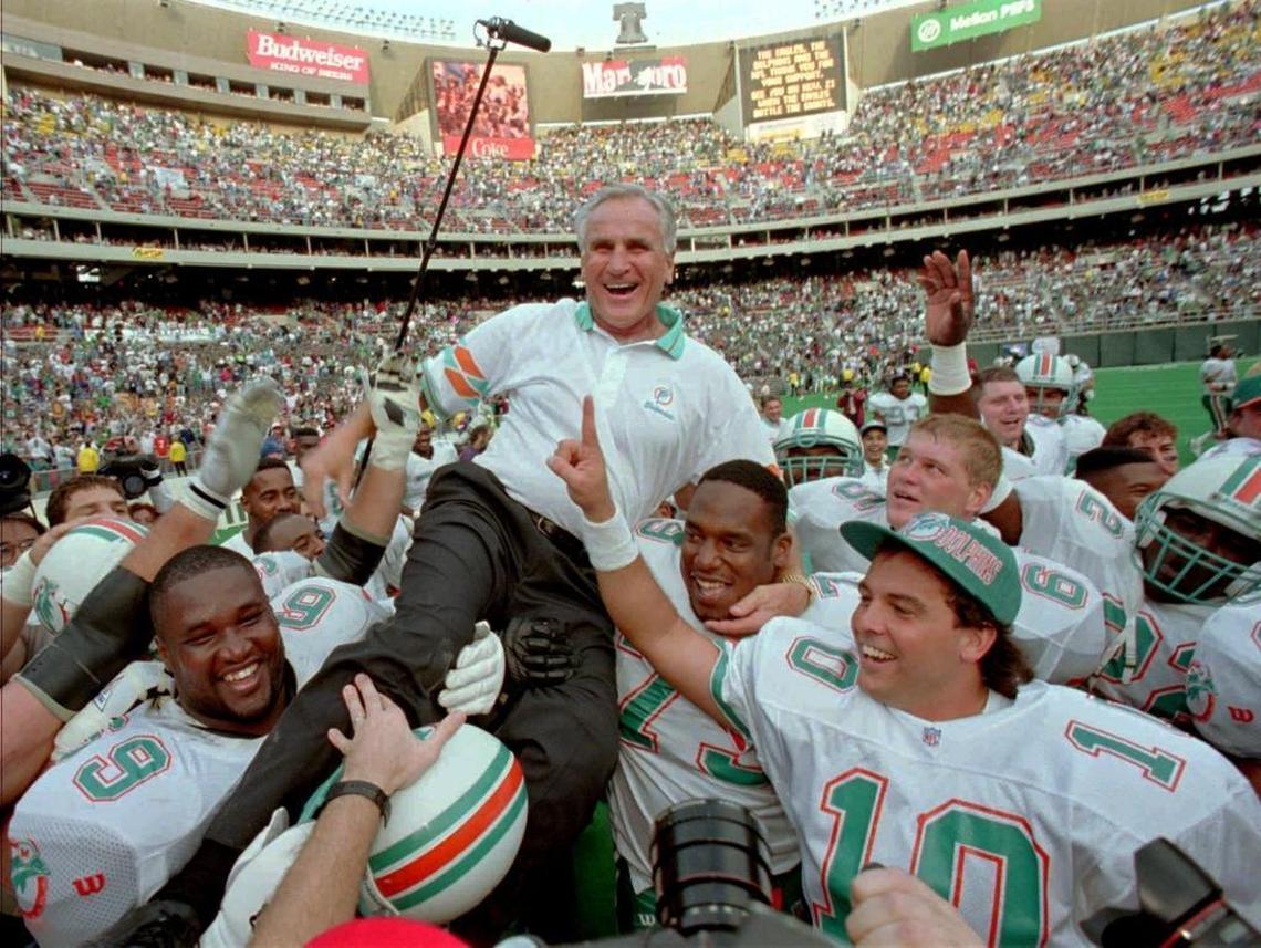 Miami Dolphins coach Don Shula is carried on his team’s shoulders after his 325th victory Sunday, Nov. 14, 1993, in Philadelphia’s Veterans Stadium. The Dolphins defeated the Eagles 19-14, making Shula the winningest coach in NFL history. He’s teaming up with former players to distribute free meals during the coronavirus crisis.