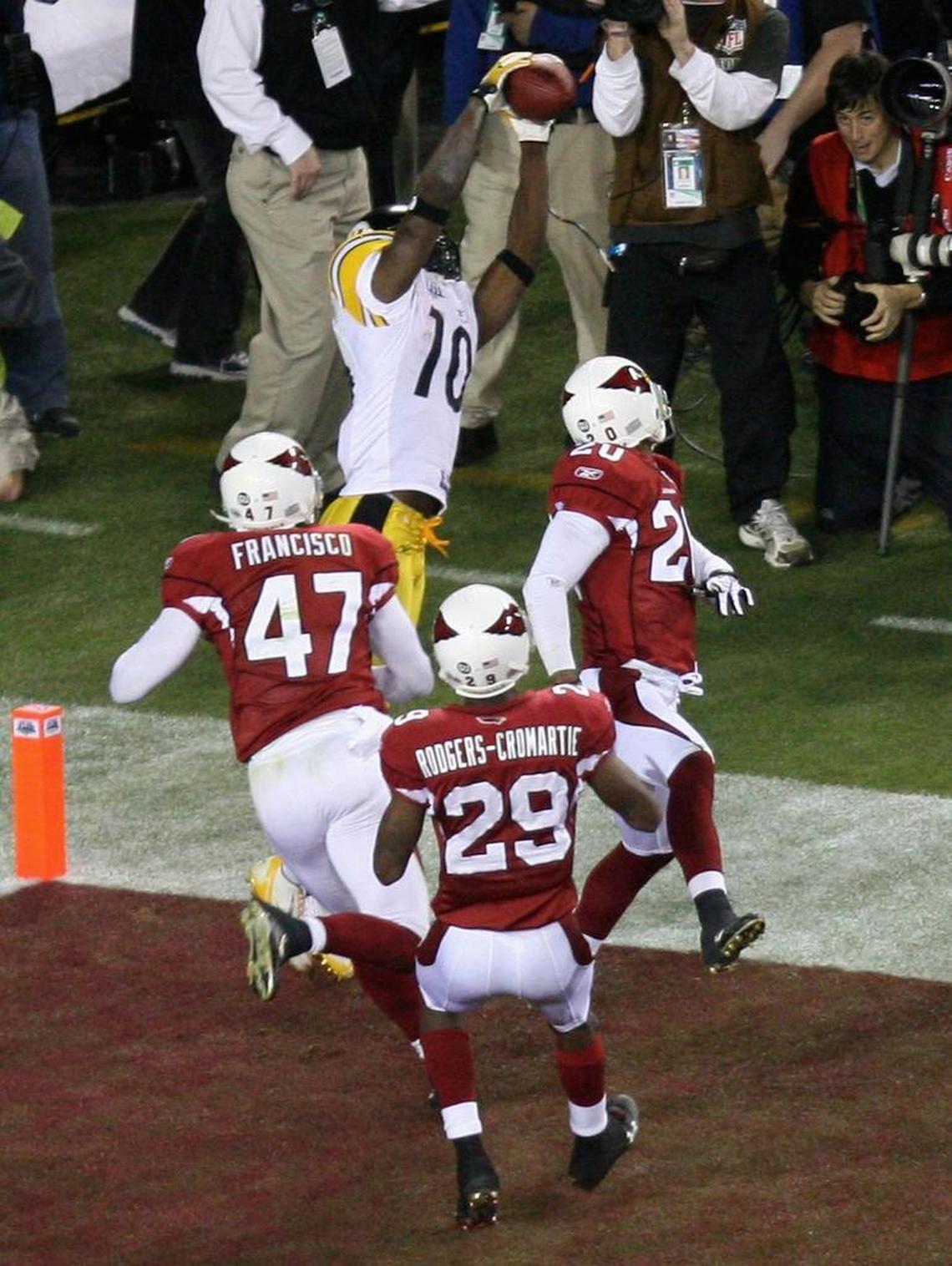 Pittsburgh wide receiver Santonio Holmes goes to his tippy toes to snag Super Bowl XLIII’s game-winning touchdown behind three stunned Arizona defensive backs
