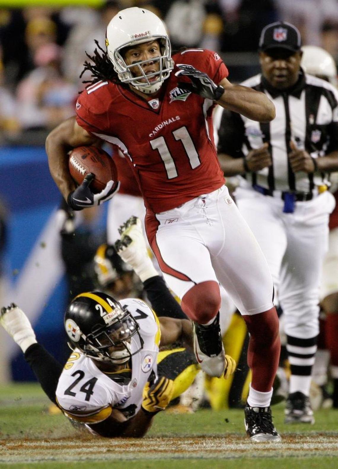 Arizona wide receiver Larry Fitzgerald bursts upfield by Steelers cornerback Ike Taylor for the 64-yard fourth quarter touchdown in Super Bowl XLIII.