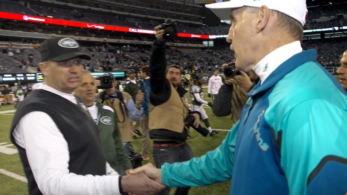 Rex Ryan and Joe Philbin shake hands after the game with the Miami Dolphins and the New York Jets at MetLife Stadium in the Meadowlands on December 1st, 2013.