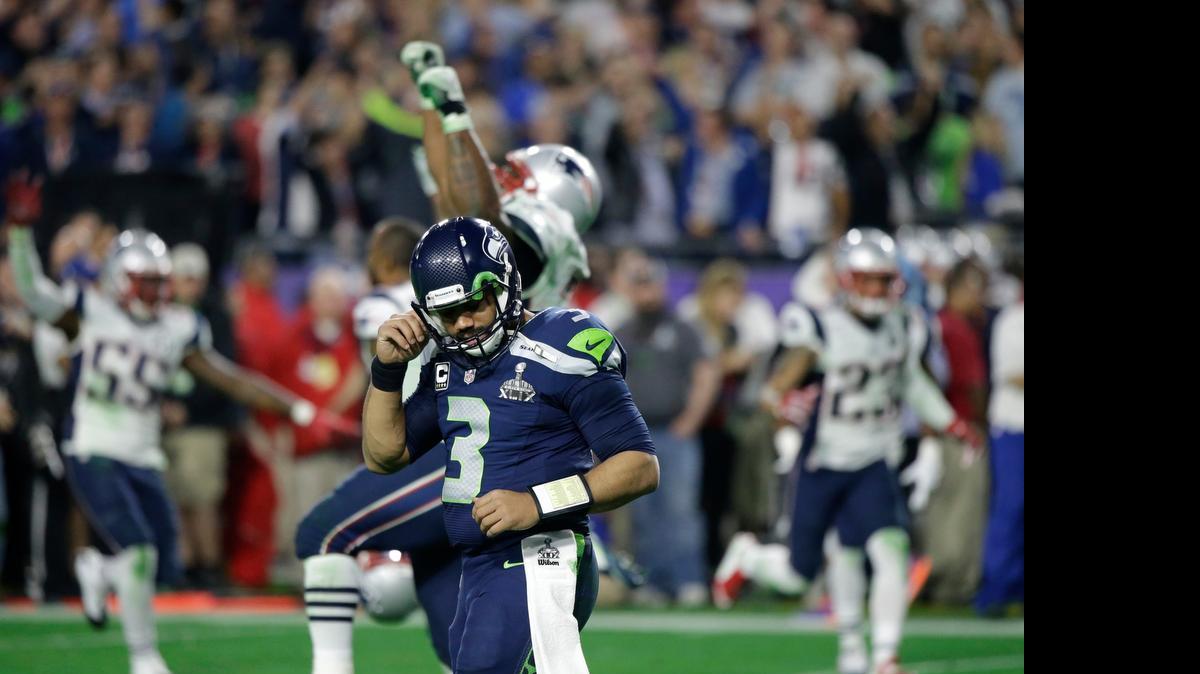 
Seattle Seahawks quarterback Russell Wilson (3) reacts after throwing an interception to New England Patriots strong safety Malcolm Butler during the second half of NFL Super Bowl XLIX football game Sunday, Feb. 1, 2015, in Glendale, Ariz. 
