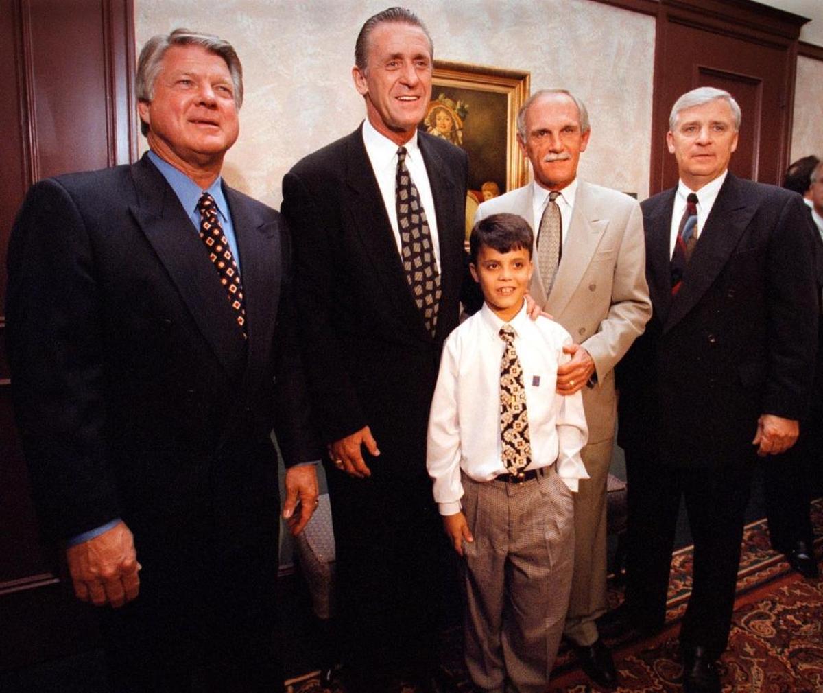 In 1998, South Florida coaches Jimmy Johnson, Pat Riley, Jim Leyland and Bryan Murray stand together with 10-year-old Michael Fernandez at the fifth annual Make-a-Wish Foundation of South Florida Sports Banquet & Memorabilia Auction at the Signature Grand in Davie.