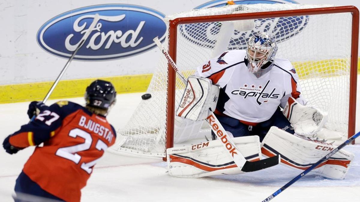 Florida Panthers center Nick Bjugstad (27) shoots against Washington Capitals goalie Philipp Grubauer (31) in the first period of an NHL hockey game, Saturday, Oct. 31, 2015, in Sunrise, Fla.