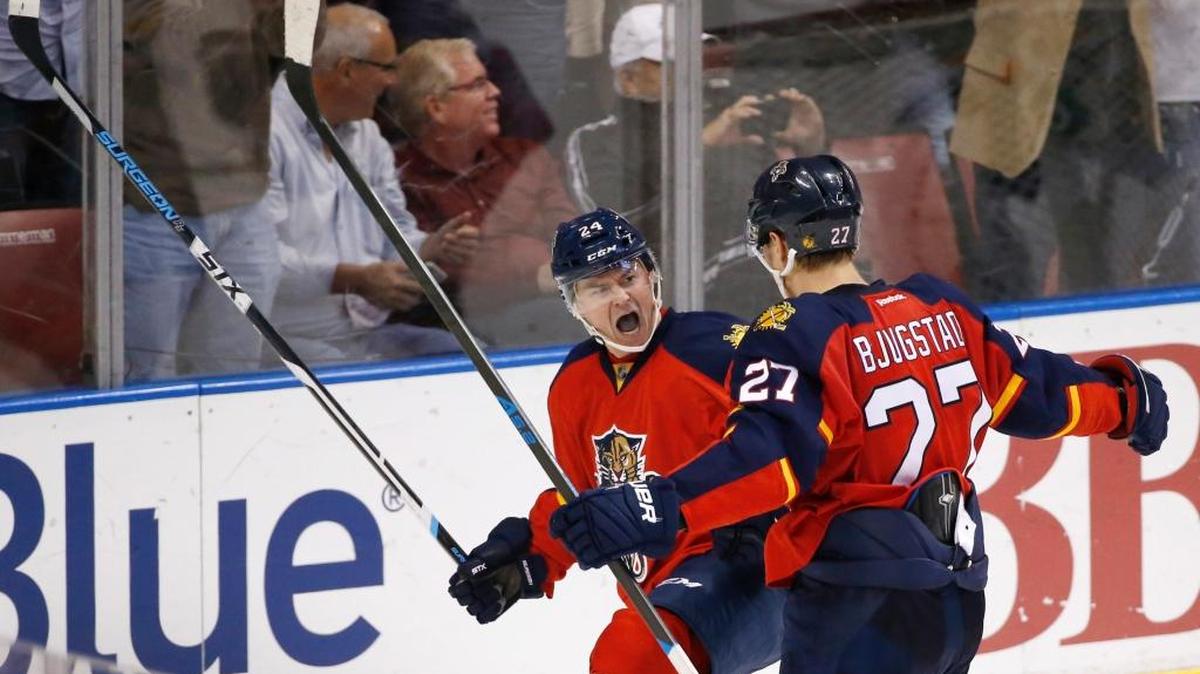 Florida Panthers right wing Jiri Hudler, left and center Nick Bjugstad celebrate after Hudler scored in the third Monday, March 8, 2016 against Calgary.