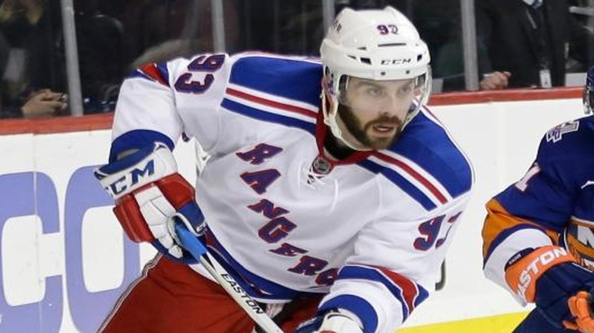 In this Jan. 14, 2016, file photo, New York Rangers' Keith Yandle (93) works with the puck as New York Islanders' Frans Nielsen (51) follows during an NHL hockey game in New York. Yandle signed with the Florida Panthers early Thursday, June 23, three days after the team acquired the high-scoring defensemanâ€™s negotiating rights in a trade with the Rangers. The Panthers sent a sixth-round pick in the draft this week to the Rangers on Monday, and now owes New York a fourth-round pick next year after successfully signing the 29-year-old Yandle. He was set to become an unrestricted free agent July 1.